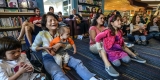 Parents and children at library storytime