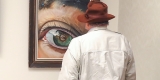 Photo of painting and onlooker in Caldwell Gallery