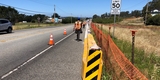Railing and crash cushions installed along the Highway 1 shoulder