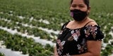 Photograph of woman standing masked in field