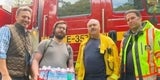 Supervisor Mueller distributing water during storm