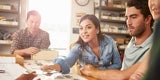 Two people gathered at a table to work collaboratively