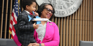 Supervisor Lisa Gauthier, holding her 4-year-old grandson Camden, was sworn in at the Jan. 7 board meeting.