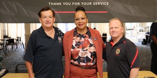 Supervisor Lisa Gauthier standing with two people