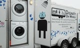 Side shot of the Dignity on Wheels shower and laundry truck.