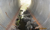 Corroded corrugated metal pipe to be replaced