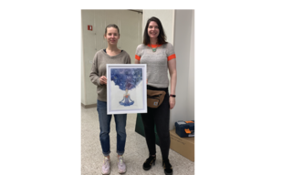 Artist stands with her painting featuring blue clouds emerging from a woman's mind, heart, and body