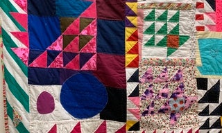 Brightly colored patchwork quilt close up