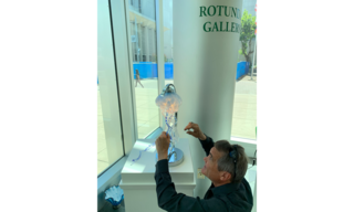 Man assembles jellyfish lamp