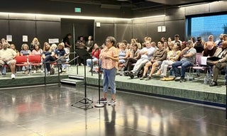 audience, one woman at mic