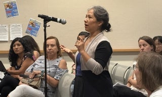 woman speaking into mic