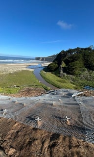 Tunitas Creek Slide Repair Pinned Mesh System April 2026.JPG