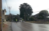 Road workers resurfacing a road with cape seal