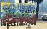 Handmade sign reading Our Heroes Alice's Restaurant Skywood Training Post Engine 58 Thank you