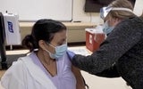 woman getting a vaccine