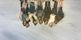 painting of a reflection of a group of people