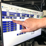 Dispatcher points at screen