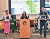 Supervisors Gauthier and Mueller hold tsunami warning signs