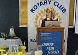 jackie behind podium speaking