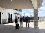 four people in courtyard