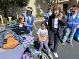 Woman and girl looking at backpacks