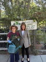 Jackie and gardener with watering can