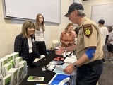 woman speaking to sheriff officer