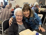 two women smiling at camera