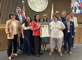 Board members presenting proclamation
