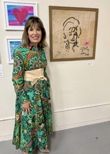 woman standing in front of pictures