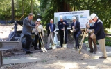 County officials dig into the earth at the groundbreaking ceremony for the new station.