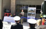 County Manager John Maltbie addresses firefighters and members of the community gathered to celebrate the construction milestone.