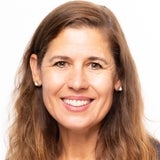 woman with light brown hair smiling