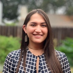 woman with long hair smiling