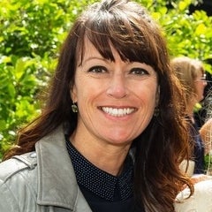woman with brown long hair and is smiling