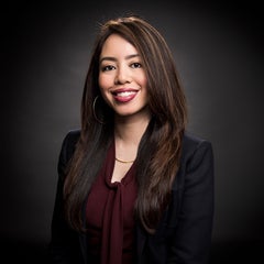 woman with long dark brown hair smiling