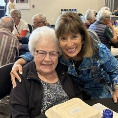 two women smiling at camera