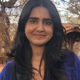 Teen with long brown hair and smiling